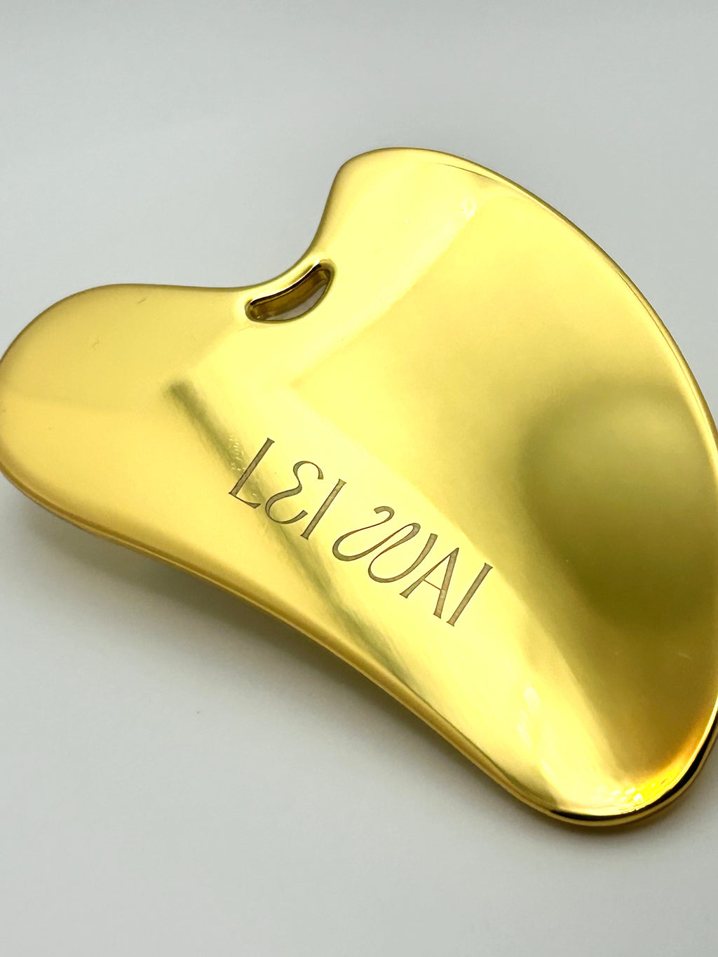 Golden gua sha beauty tool